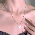Minimalist silver star pendant necklace with delicate bead chain on model's neckline - Silver Beaded Snake Chain Star Necklace (12455)