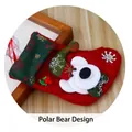 Christmas stocking featuring a 3D plush bear with green hat and snowflake patterns - M3-4 Small Village Bear