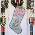 Detail of white Christmas stocking with Nutcracker soldier pattern and pink plush trim - Style F