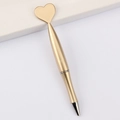 Creative gold heart-shaped pen with streamlined body on minimalist white background - Heart / Gold