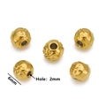 Macro shot of 6mm hollow gold floral spacer beads for DIY jewelry making with 2mm holes - Style I / Gold