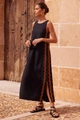Detailed view of women's black sleeveless midi dress with brown wave lace trim and side slit - S / Black