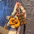 Cute pretzel and chocolate dessert charm keychain with brown woven lanyards for bags - Pretzel-Knot + Chocolate