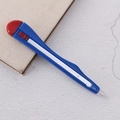 Blue tool-shaped ballpoint pen with red retractable button on a desk background - Blue Utility Knife