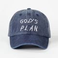 Close-up of white GOD'S PLAN embroidery on a washed navy blue denim baseball cap - One Size / Navy Blue
