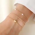 Driedelige goudkleurige gelaagde armbandset met parels en hartjes hangers - Gouden Parel Hart Set / Goud-4
