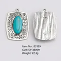 Vintage silver alloy pendant with oval turquoise and tribal pattern engraving 54x38mm - Tribal Oval