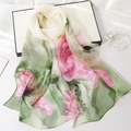 Elegant long silk scarf with pink lotus and green leaf ink print on white surface - Ink Lotus Green