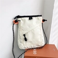Detail of off-white nylon crossbody bag with rope strap and diagonal stitching on orange box - White