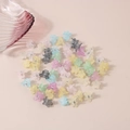 Mini matte flower hair claws in macaron colors scattered on a beige background - Flower Style / Bulk Packaging / Matte Light Colors