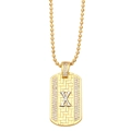 Detail of gold and silver rectangular X pendant with pavé crystals on bead chain - Letter X