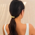 Polished gold metallic ponytail cuff with high-elastic band on a model's hair - Gold (0557)
