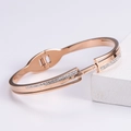 Bracciale in oro rosa con numeri romani e cristalli su piedistallo geometrico - Oro rosa