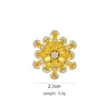 Elegant gold flower brooch featuring bright yellow cubic zirconia and white accents - B744 Golden/Snowflake