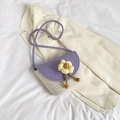 Handwoven bucket bag in purple and beige featuring a yellow flower and slim shoulder strap - Purple