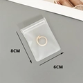 Detailed view of 8x6cm transparent EVA storage bag showing size for small jewelry items - Frosted EVA (6*8CM)