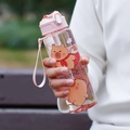 Pink Capybara cartoon water bottle with straw and carrying strap for students - Transparent Pink