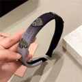 Detailed view of the purple velvet headband with sparkly black sequin heart patterns - Light Purple