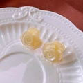 Macro shot of creamy white floral stud earrings on a vintage textured ceramic plate - 20# Cream 3D Rose (925 Sterling Silver Earring Post)