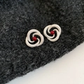 Silver-toned spiral crossover hoop earrings featuring a bright red center bead accent - Spiral Vortex Red Ball Style (71#)