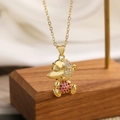 Detailed close-up of gold-plated platypus pendant with rose red and clear zircon stones - Pink Platypus Style(23651)