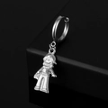 Detailed close-up of a silver stainless steel hoop earring with astronaut boy charm - Boys