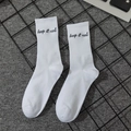 White mid-calf cotton crew socks featuring black Keep It Real embroidery and ribbed texture - Keep It Real