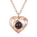 Elegant rose gold heart pendant necklace with projection stone on white background - Three-hole Heart Rose Gold