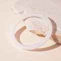 Close-up of a white translucent acrylic geometric round bangle with a smooth resin finish - White Round Style (18#)