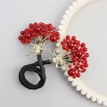 Chignon élégant avec fleurs en zircon rouge, nœuds dorés et élastique noir - Bouquet Rouge