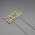 Detailed view of a golden Happy Birthday cake topper with shimmering rhinestone inlay - Gold