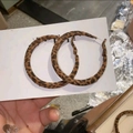 Macro detail of leopard print round hoop earrings held against a white card display - 6# Silver Earring Post - Brown - Round