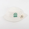 Cream white cotton bucket hat for children featuring a green silicone smiley face detail - CM8001 Smiley Series / White
