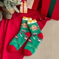 Green coral fleece Christmas socks featuring 3D gingerbread man and candy cane patterns - Gingerbread Man