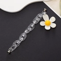 Detail of acrylic phone strap featuring white daisy pendant and metal magnetic clasp - White Sunflower Daisy