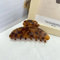 Detail of large amber tortoiseshell hair claw clip made of acetic acid for ponytails - Tortoiseshell 1