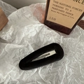 Macro shot of minimalist black velvet teardrop hair clip with soft plush texture details - Water Drop / Black