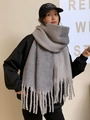 Thick grey mohair scarf with tassels for winter, worn by model with black hoodie - Gray