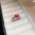 Macro view of silver ring featuring an oval orange gemstone and pavé set small diamonds - 29# Ring - Orange Oval