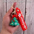 Christmas tree PVC keychain with red silicone hand strap and metal ring hanging on hand - Christmas Tree-7