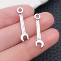 Silver wrench pendants in alloy metal for DIY necklaces and keychain accessories - 5x24mm 0.8g