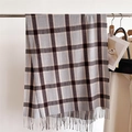 Detail of grey plaid scarf with soft fringe texture and woven check pattern on hanger - Gray & Brown Plaid (WT153-2)