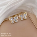 Detail of gold butterfly stud earrings with sparkling white zircons on a jewelry box - Copper Real Gold Plated + Zircon / Golden Butterfly Stud Earrings (D524)