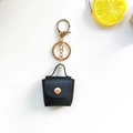 Mini porte-clés sac en cuir noir avec bouton pression doré et mousqueton élégant - Noir