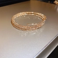 Detail of rose gold multi-layer beaded wrap bracelet with fine metallic texture - Rose Gold Multi-loop Wrapped Style