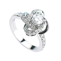 Elegant white gold plated ring featuring a round cut solitaire in a twisted petal setting - JZ040 (1 Carat)