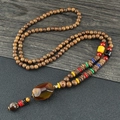 Ethnic wooden bead long necklace with a large agate pendant and colorful spacer beads - Resin Octagon