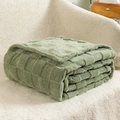 Soft sage green checkerboard waffle fleece blanket folded on textured white background - Sage Green