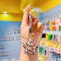 Stervormige sleutelhanger met bruine en zwarte strass-steentjes en bijpassend lint - Gemengd Paars