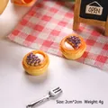 Close-up of a 2cm miniature grape tart model made of resin for dollhouse decor - Red Bean Egg Tart